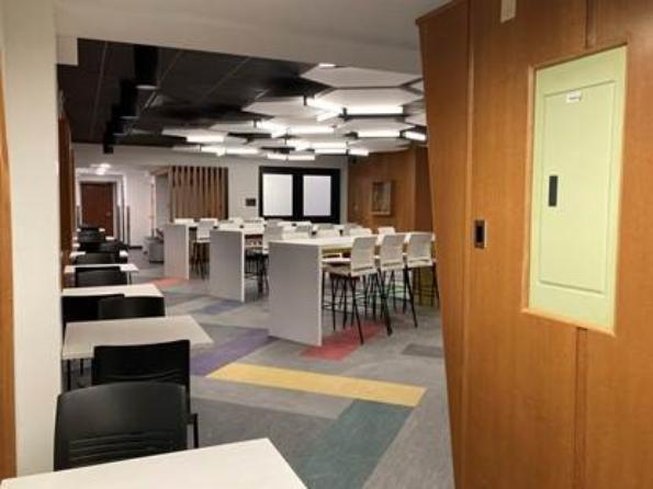 Existing oak wall panels were removed in the main lobby and were re-used to create an angled wall that looks original to the building